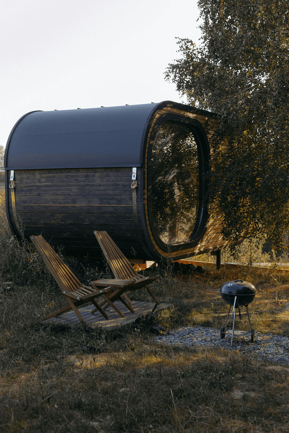 Outdoor barrel sauna with seating