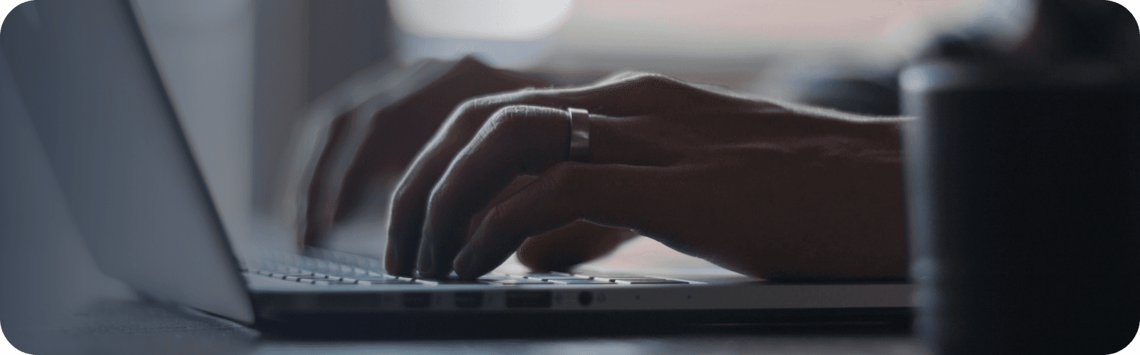 Person writing on keyboard